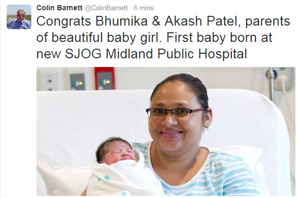 A tweeted message with a picture of mother and newborn baby