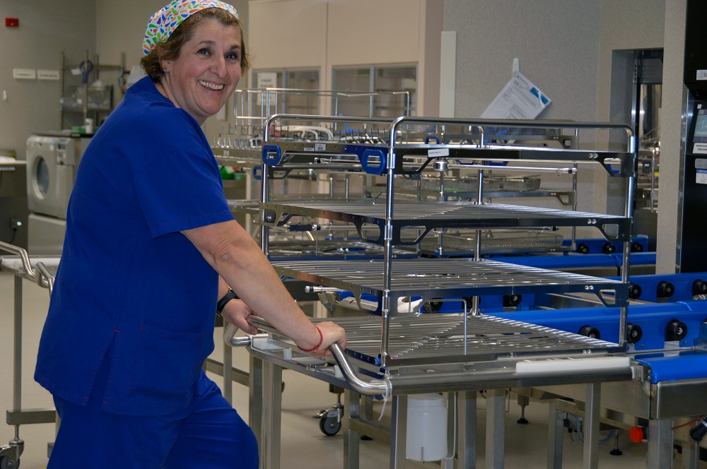 Sladjana Neskovic, Clinical Nurse Manager, Perth Children's Hospital Central Sterilisation Services Department wheeling a silver instrument trolley