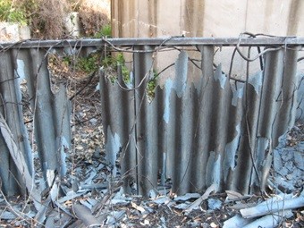 burnt asbestos fence
