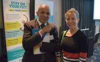 Dr Sudhakar Rao (left) and Dr Kate Ingram (right) stand in front of Stay on Your Feet falls prevention banner.