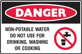 Sign – Black, red and white danger sign with symbol indicating the water should not be drunk and text stating: “Non potable water, do not use for drinking, washing or cooking”.