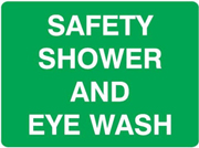 Sign – White text on green background stating “Safety shower and eye wash”.