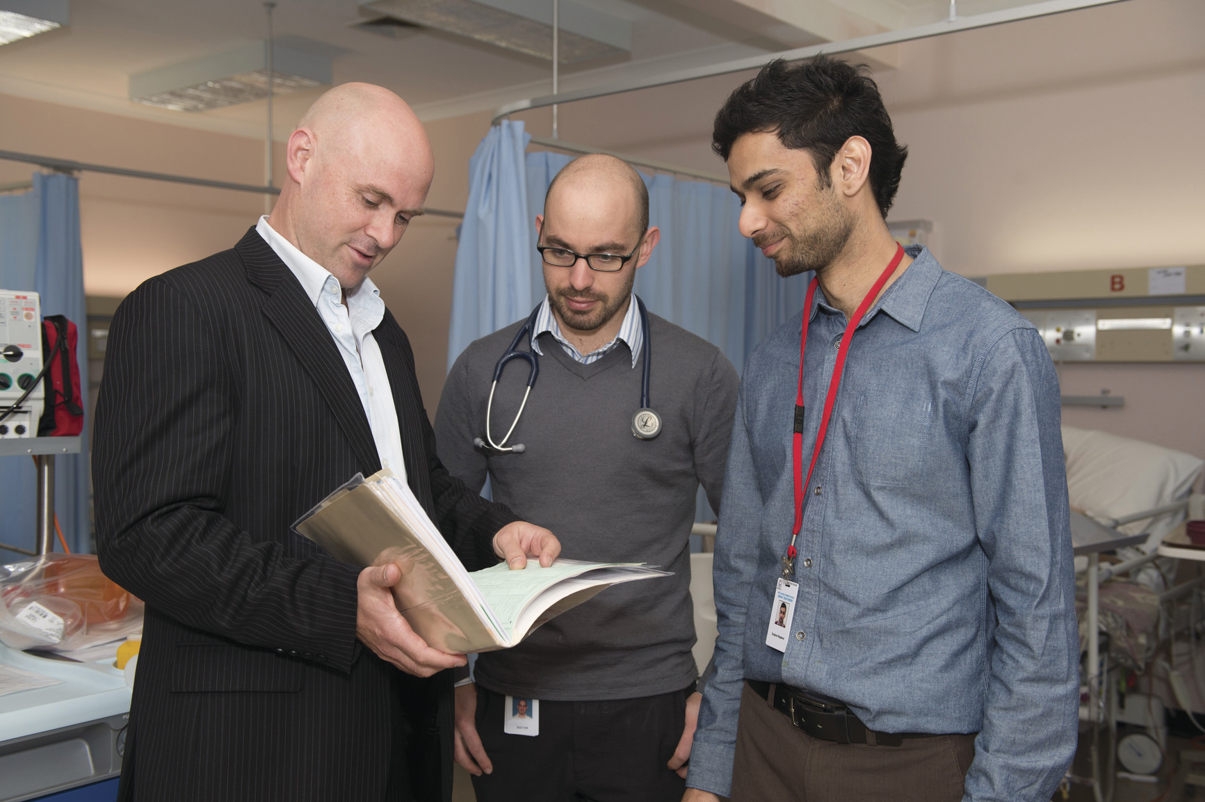 Doctors reviewing patient file