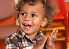 Aboriginal toddler clapping his hands